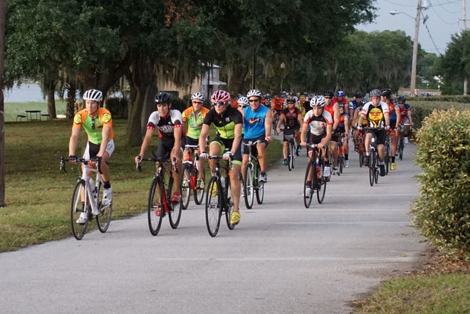 The head of the pack makes the return trip to Waterfront Park. It was the fourth year for the Ride of Silence in Clermont, an event initiated by Sara McLarty and Lacy Nickell, who both lost their fathers in bicycle accidents.