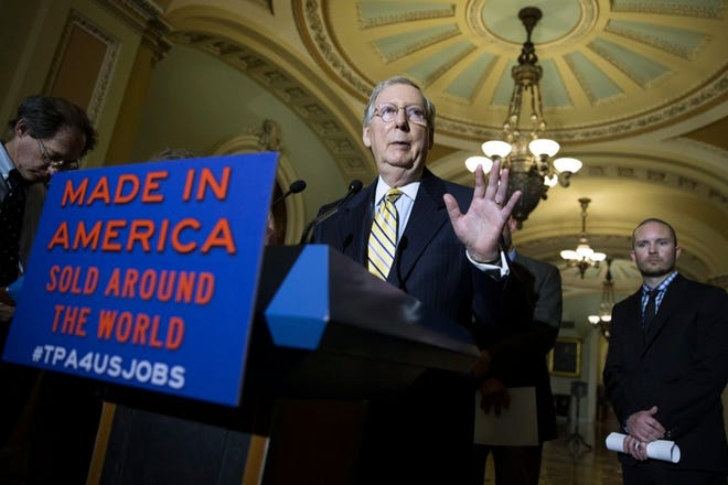 Senate Majority Leader Mitch McConnell of Kentucky speaks during a news conference on Capitol Hill in Washington on Tuesday to discuss the Trade Promotion Authority bill.