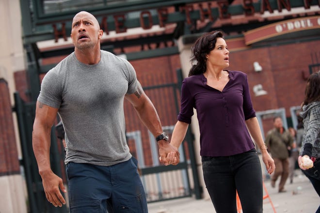 Dwayne Johnson takes action and Carla Gugino wisely goes with him in "San Andreas."