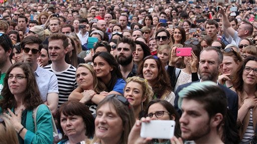 Yes supporters wait for the final result at Dublin castle, Ireland, Saturday, May 23, 2015. Ireland has voted resoundingly to legalize gay marriage in the world's first national vote on the issue, leaders on both sides of the Irish referendum declared Saturday even as official ballot counting continued. Senior figures from the "no" campaign, who sought to prevent Ireland's constitution from being amended to permit same-sex marriages, say the only question is how large the "yes" side's margin of victory will be from Friday's vote. (AP Photo/Peter Morrison)