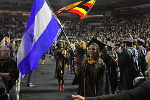 Students take part in the International Parade of Flags at the opening of the commencement. Johnson & Wales University, held its commencement for John Hazen White College of Arts and Sciences on Saturday.
