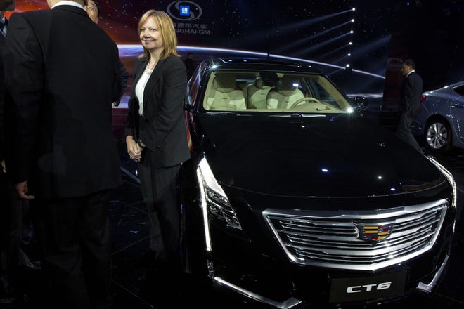 General Motors CEO Mary Barra stands next to the Cadillac CT6 luxury sedan in advance of the Auto Shanghai show in China last month. The CT6 is big enough to satisfy luxury buyers, but with its an aluminum and lightweight steel construction it needs only a turbocharged 4-cylinder base engine. 



AP/Ng Han Guan