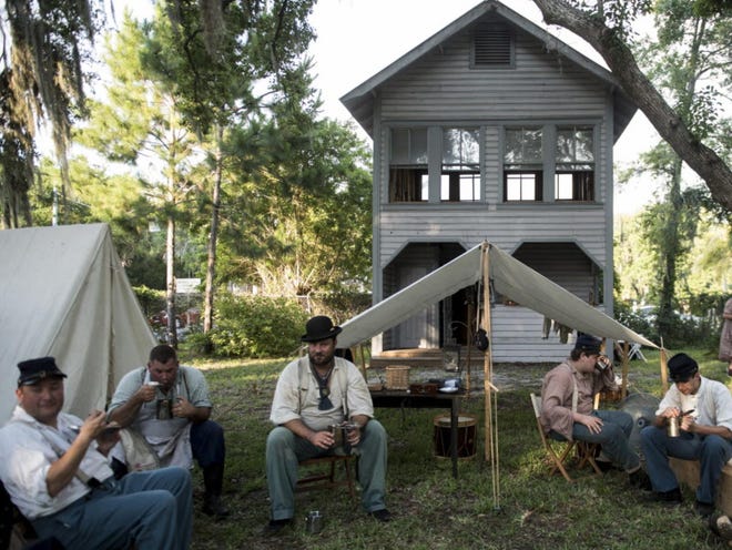 Federal Civil War re-enactors gather for dinner during the Occupation of Manatee on Friday at the Manatee Village Historical Park in Bradenton.