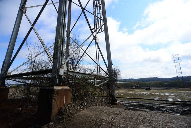 An electric tower is surrounded by mud on Chuck Betters' property in the Aliquippa Industrial Park, site of the former J&L tin mill plant.