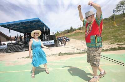 Photos by Daniel Freel/New Jersey Herald Kay Jackson, of Rockland Township, Pa., left, dances with Sam Emmonis, of Branchville, during Mountain Creek’s Smoke N Blues music festival Sunday in Vernon.