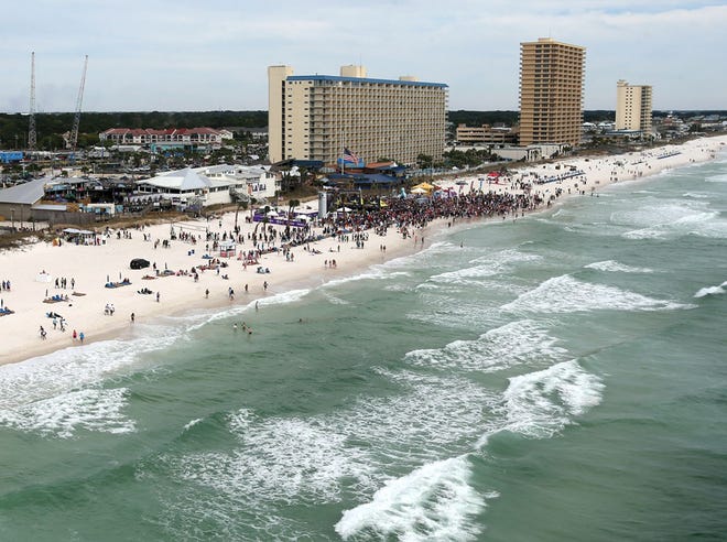 Spring breakers crowd the beach in front of the super clubs in Panama City Beach on March 27. University of West Florida economics professor Rick Harper said it could be more difficult for Bay County’s economy to rebound from a major loss of spring breakers than it was in Volusia and Broward counties, former Spring Break hot spots.
