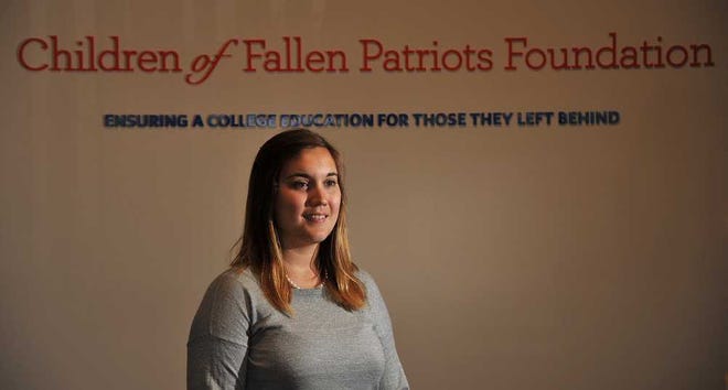 Photos by Bruce.Lipsky@jacksonville.com Sarah Cramer, 24, lost her father, Staff Sgt. Paul Cramer, of the Virginia Air National Guard, in 2001. She has found comfort helping others with Children of Fallen Patriots, a foundation based in Jacksonville Beach.