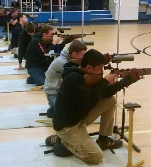 RONALD AYTONA, front, and other members of the Summerlin rifle team compete at the Florida Junior Olympics earlier this month.