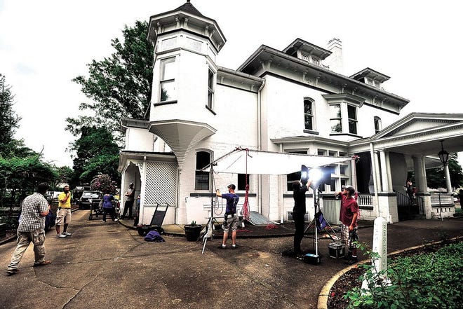 A film crew sets up Tuesday at the J.E. Reeves Home and Museum in Dover, where it is filming scenes for the movie “Love Finds You in Valentine,” starring Ed Asner, Lindsay Wagner, Michaela McManus and Diogo Morgado.