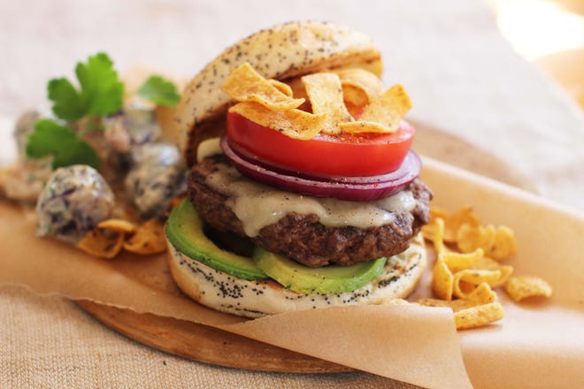 This California Dreaming Burger is made with Monterey Jack cheese, sliced avocado, tomato and sliced red onion.