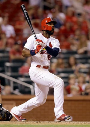 St. Louis Cardinals' Jason Heyward watches his solo home run during the ninth inning of a baseball game against the Arizona Diamondbacks Wednesday, May 27, 2015, in St. Louis.