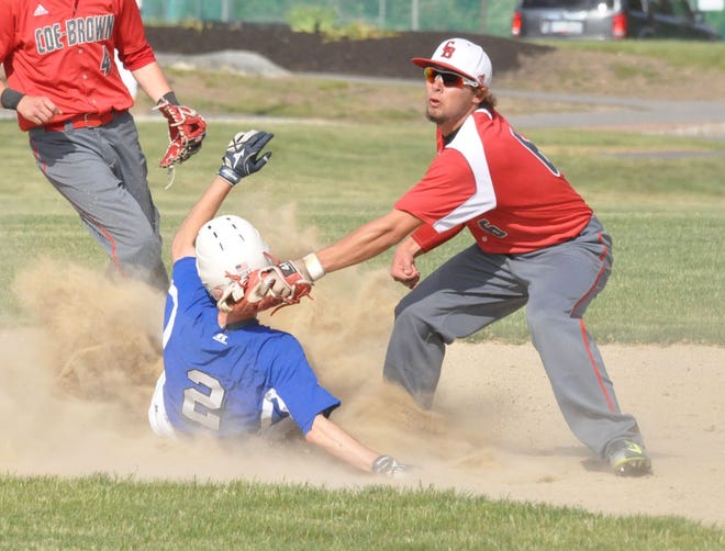 Coe-Brown second baseman Noah DuBois, right, tags out Oyster River's Aidan Short trying to steal during Wednesday's Division II baseball game in Durham. Mike Whaley/Foster's Daily Democrat