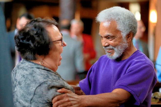 Nebraska state Sen. Ernie Chambers of Omaha, right, celebrates with Sen. Kathy Campbell of Lincoln after the one-house Legislature voted 30-19 to override Gov. Pete Ricketts, a Republican who supports the death penalty. The vote makes Nebraska the first traditionally conservative state to eliminate the punishment since North Dakota in 1973. (AP Photo/Nati Harnik)