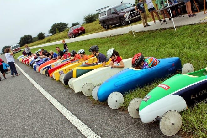ABOVE: More than 40 children between the ages of 7 and 18 will be racing down the hill on Wilson Lake Parkway in Groveland on Saturday. These kids were getting ready at a recent race. BELOW: Wilson Lake Parkway is between the Trilogy and Vineyard subdivisions. Races begin at about 9 a.m.