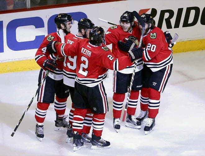 Chicago right wing Patrick Kane,  second from right, celebrates his goal against Anaheim with teammates during the second period in Game 6 of the Western Conference finals.