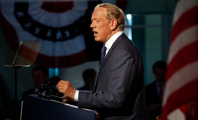 Former New York Gov. George Pataki announces his plans to seek the Republican nomination for president Thursday at the historic town hall in Exeter, N.H.