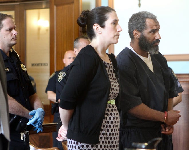 Leopoldo Belen, right, is arraigned in Superior Court on Thursday for murder and other charges related to the 2013 fatal beating of Delor Cabral. Another man had been wrongfully accused of the killing. With Belen is public defender Sarah Wright. The Providence Journal/Mary Murphy