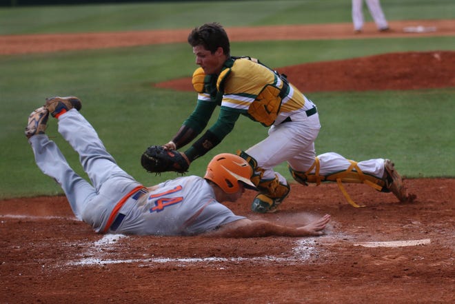 Bradley Keller tags out Marvin Ridge Jake Boyce at home Thursday night a Crest in the West Regional Game 2 Final of 3A State Playoffs. (Hannah Covington/ The Star)