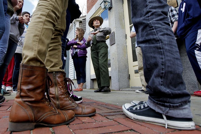 Park Ranger Lucy Bly gives students of Portsmouth Middle School a history lesson on historic New Bedford while standing in front of the Sundial Building on Union Street in downtown New Bedford. The New Bedford Whaling National Historical Park offers walking tours spring through fall.

PETER PEREIRA/STANDARD-TIMES FILE