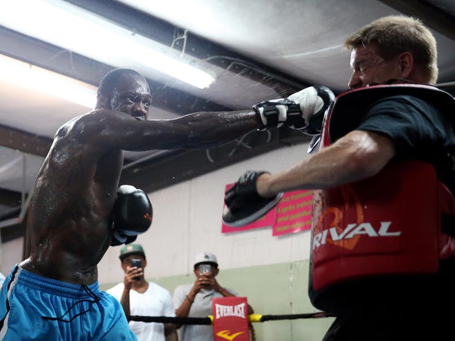 WBC champion Deontay Wilder mitt-trains with head training coach Jay Deas during a training session at Skyy Boxing in Northport in preparation for Wilder's June 13 fight against Eric Molina.