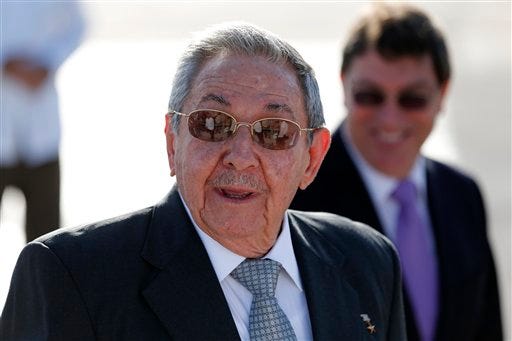File photo - Cuba's President Raul Castro speaks to reporters alongside his Foreign Affairs Minister Bruno Rodriguez Parrilla at the Jose Marti airport after escorting France's President Francois Hollande to his plane in Havana, Cuba, Tuesday, May 12, 2015. (AP Photo/Desmond Boylan)