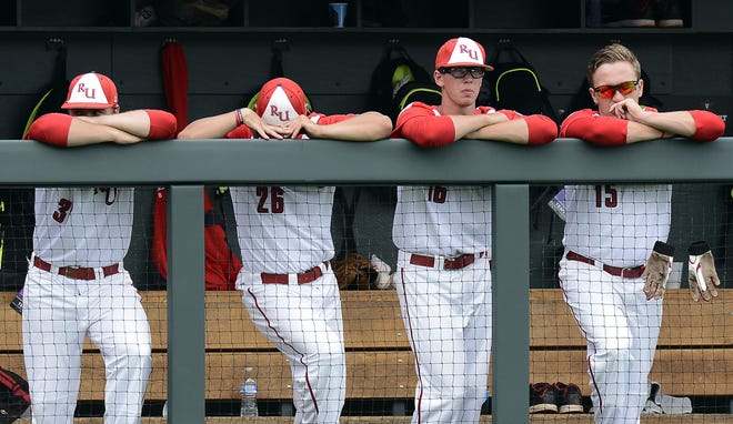 From left to right, Radford's Hunter Higgerson, Zack Ridgley, Austin Ross and Kyle Zurak stand in the dugout after Indiana's Craig Dedelow hit a two-run home run during the seventh inning Friday at the Nashville Regional in Nashville, Tenn. Indiana won, 7-1. AP Photo/Mark Zaleski