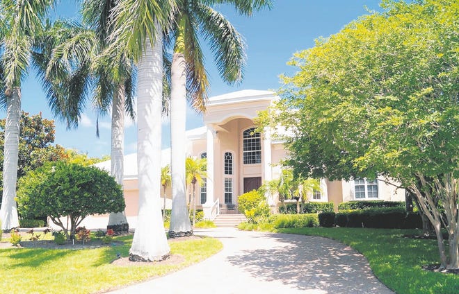 This canalfront house, one lot from Harris Bayou, at 761 Old Compass Road in 
Emerald Harbor, Longboat Key, is listed at $1.995 million by Duane and 
Rhonda Finney of RE/MAX Alliance Group. Built in 2001 by John Cannon Homes, 
it has three bedrooms and four and a half baths in 4,378 square feet. It has 
a dock and boat lift. STAFF PHOTO / HAROLD BUBIL