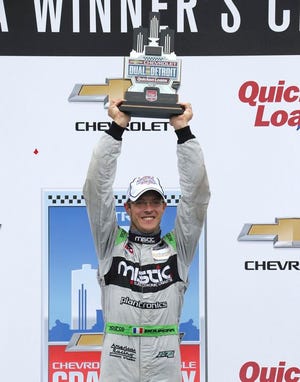 Sebastien Bourdais, of France, celebrates winning the second race of the IndyCar Detroit Grand Prix auto racing doubleheader, Sunday, May 31, 2015, in Detroit.