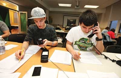 Photo by Daniel Freel/New Jersey Herald SCCC students Vincenzo Sebastano, left, and Kris Tapia make calls for the Pulse of Sussex County.