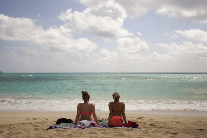 Ali Junell, of Portland, Ore., left, and Kristen Carmichael, of Los Angeles, sit on the beach at Waimanalo Bay Beach Park in Waimanalo, Hawaii. The beach was listed as No. 1 on the 2015 list of best beaches, compiled annually by Florida International University Prof. Stephen Leatherman.

AP/Caleb Jones