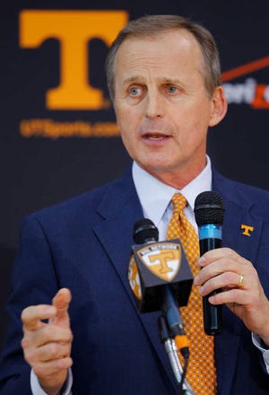 In this March 31, 2015, file photo, former University of Texas head basketball coach Rick Barnes address' reporters after being named head coach at the University of Tennessee in Knoxville, Tenn.