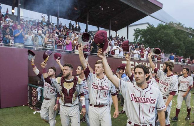 Mark Wallheiser Associated Press Florida State's Mike Compton (17), Bryant Holzmann (33), Danny De La Calle, and Quincy Nieporte (29) salute their fans after defeating College of Charleston 8-1 in the Tallahassee Regional on Monday.