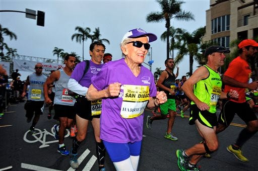 In this photo provided by Competitor Group, Harriette Thompson starts the Suja Rock ‘n’ Roll Marathon in San Diego on Sunday, May 31, 2015. Thompson, of Charlotte, N.C., is a two-time cancer survivor who dealt with the loss of her husband and a staph infection in her legs while training for this year’s race. At age 92 years and 65 days, she becomes the oldest woman to ever complete a marathon. Her son Brenny Thompson is behind her in the purple shirt. (Paul Nestor/Competitor Group via AP)