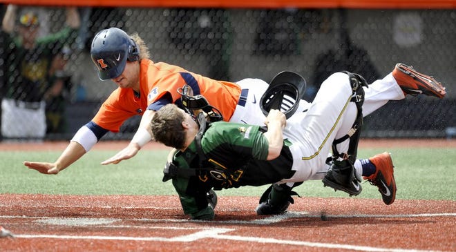 University of Illinois' David Kerian flattens Write State catcher Sean Murphy in the sixth inning during the NCAA baseball regional tournament at Illinois Field in Champaign, Ill., Monday June 1, 2015. Kerian was called out on the play. Illinois won 8-4. (Rick Danzl/The News-Gazette via AP) MANDATORY CREDIT