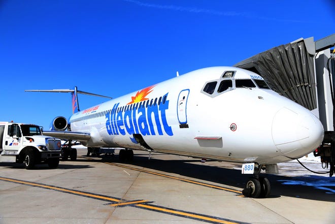 A MD-80 Allegiant aircraft is directed to the jetway, after landing at the Portsmouth International Airport at Pease. Photo by Rich Beauchesne/Seacoastonline, file