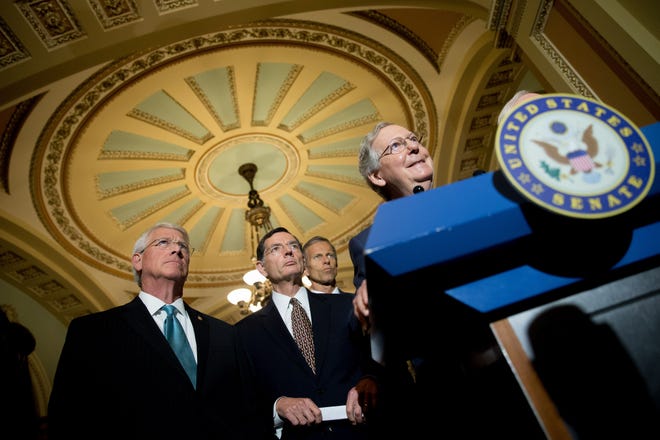 Senate Majority Leader Mitch McConnell of Ky., right, accompanied by, from left, Sen. Roger Wicker, R-Miss., Sen. John Barrasso, R-Wyo., and Sen. John Thune, R-S.D., speaks to the media during a news conference on Capitol Hill in Washington, Tuesday, June 2, 2015, following a Senate policy luncheon, as legislation to end the National Security Agency’s collection of Americans’ calling records while preserving other surveillance authorities is expected to clear the Senate late Tuesday. But House leaders have warned their Senate counterparts not to proceed with planned changes to a House version.