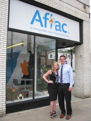 Ellwood City native Caroline Golmic, left, formerly Caroline Ovial, and her husband, Scott Golmic, operate the Aflac office at 201 Fifth St., Ellwood City.