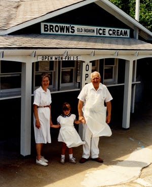 Betty and Byron Brown, with granddaughter Corrie Brown, stand in front of Brown's Old Fashion Ice Cream in 1992 - the last year they ran the business. Courtesy photo