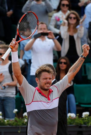 Stan Wawrinka celebrates winning his quarterfinal match against Roger Federer. The Associated Press
