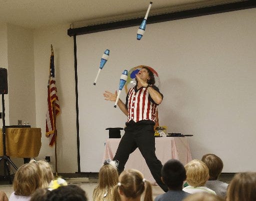 Juggler Tom "Foolery" Rayburn performs during an event with the summer reading program at the Tuscaloosa Public Library, Tuesday June 10, 2014. The Tuscaloosa News | Erin Nelson