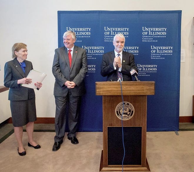 New University of Illinois President Timothy Killeen talks with the media at Henry Administration Building on his first day on the job Monday, May 18, 2015 in Urbana, Ill. Standing to Killeen's left are Susan Koch, chancellor of the University of Illinois Springfield campus, and Michael Amiridis, chancellor of the University of Illinois Chicago campus. Killeen said one of his top priorities will be emphasizing the value of the university to lawmakers as they work on a state budget. And Killeen wants to make the university a stronger part of efforts to revitalize the state's economy. (Rick Danzl/The News-Gazette via AP )