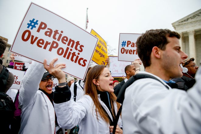 In this March 4 file photo, demonstrators chant during a health care rally outside the Supreme Court in Washington. The Supreme Court could wipe away health insurance for millions of Americans when it resolves the latest high court fight over President Barack Obama's health overhaul. But would the court take away a benefit from so many people, and should the justices even consider the consequences?