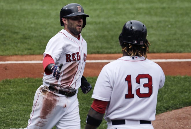 Dustin Pedroia (left) had four hits in Wednesday's afternoon game.