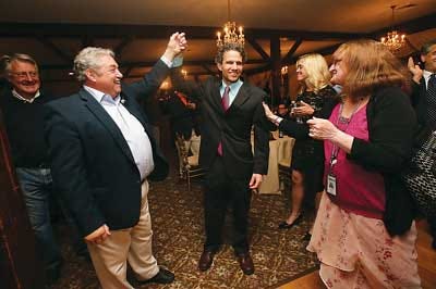 Photo by Daniel Freel/New Jersey Herald Republican candidates for Sussex County Freeholder Carl Lazzaro, left, and Jonathan Rose raise their arms in victory after the results of the primary election are announced in their favor.