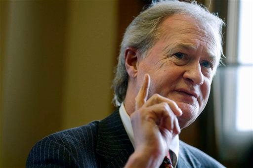 FILE - In this Dec. 11, 2014, file photo, Rhode Island Gov. Lincoln Chafee responds to questions during an interview with The Associated Press in his office at the Statehouse, in Providence, R.I.