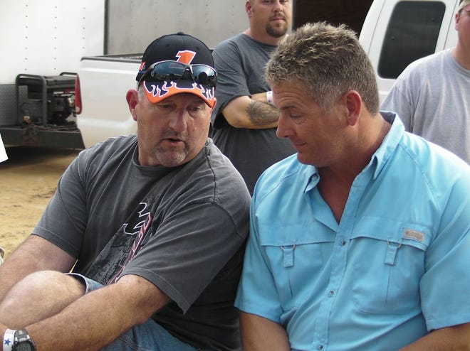 Ricky Weeks, the Carolina Clash champion from 2004-08, chats with Scott Autry, the Clash titlist in 2002, prior to a Carolina Clash series drivers' meeting at Fayetteville Motor Speedway.