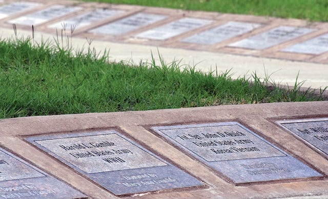 CHAD HUNTER • TIMES RECORD   Plaques for veterans are seen Tuesday, June 2, 2015, at Greenwood's Veterans Memorial Park.