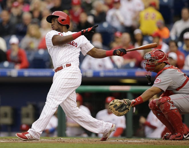 The Phillies' Maikel Franco follows through after hitting an RBI-double off Reds pitcher Anthony DeSclafani during the first inning of a baseball game Thursday, June 4, 2015.