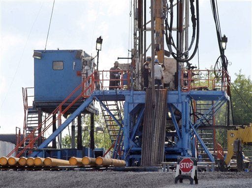 A crew works on a gas-drilling rig at a well site for shale-based natural gas in Zelienople in 2012.