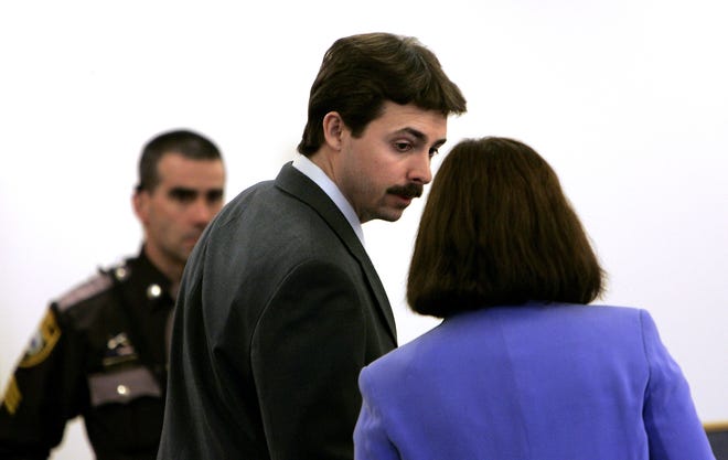 In a Jan. 25, 2008 file photo, William Flynn, center, talks to his defense lawyer Cathy Green, right, at Rockingham Superior Court in Brentwood. (AP Photo/Cheryl Senter, Pool, File)